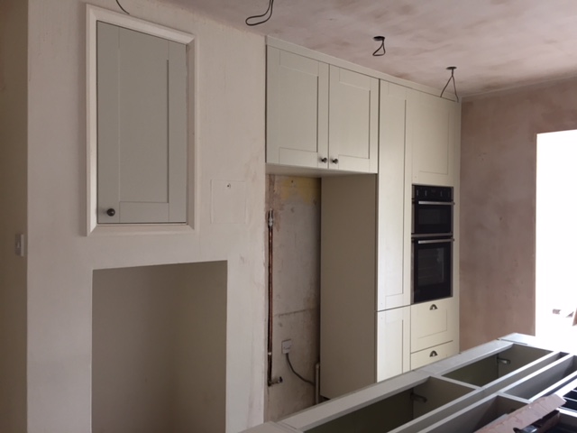 Kitchen fitted ready for floor and corian tops